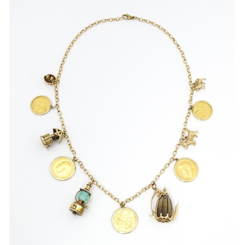 767 - A 9ct gold and yellow metal chain necklace set with three sovereigns in captive mounts, and two half... 