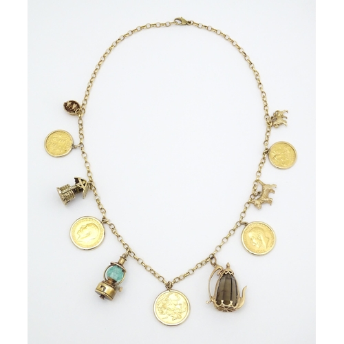 767 - A 9ct gold and yellow metal chain necklace set with three sovereigns in captive mounts, and two half... 