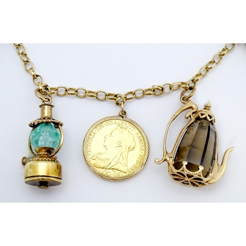 767 - A 9ct gold and yellow metal chain necklace set with three sovereigns in captive mounts, and two half... 