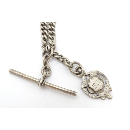 773 - A silver Albert watch chain, with a silver fob hallmarked 1912. Fob approx. 1