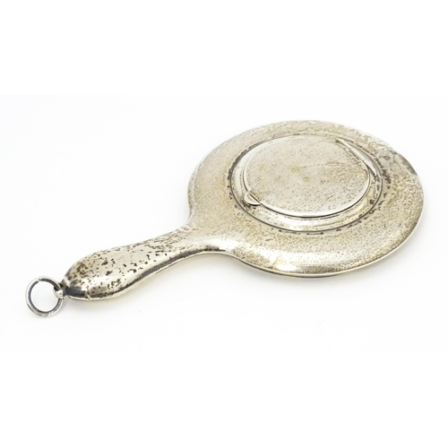 385 - A small silver hand mirror with compact section to back. Approx 4 1/4