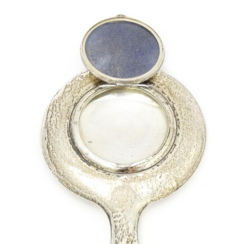 385 - A small silver hand mirror with compact section to back. Approx 4 1/4