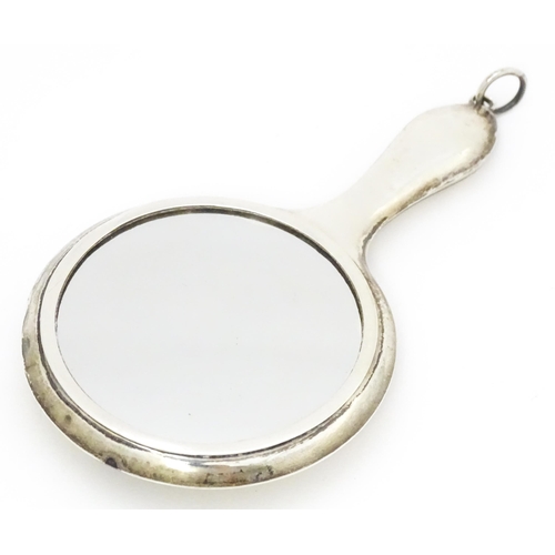 385 - A small silver hand mirror with compact section to back. Approx 4 1/4