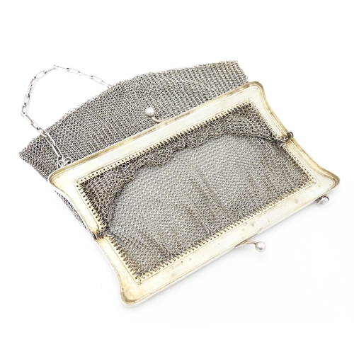 528 - A Continental white metal cigarette case with blue enamel detail. Together with a silver plate mesh ... 