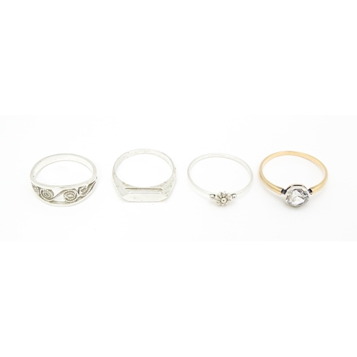 622 - 4 assorted white metal and yellow metal rings (4)