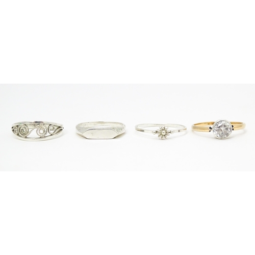 622 - 4 assorted white metal and yellow metal rings (4)