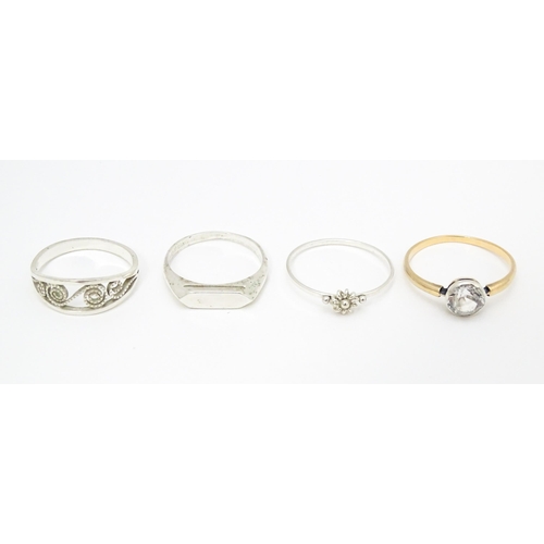 622 - 4 assorted white metal and yellow metal rings (4)