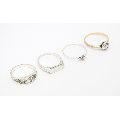 622 - 4 assorted white metal and yellow metal rings (4)