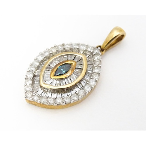 629 - A 9ct gold pendant set with a profusion of diamonds  and central coloured diamond. Approx. 3/4