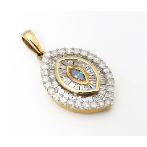 629 - A 9ct gold pendant set with a profusion of diamonds  and central coloured diamond. Approx. 3/4