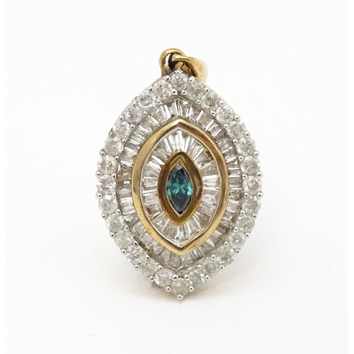 629 - A 9ct gold pendant set with a profusion of diamonds  and central coloured diamond. Approx. 3/4