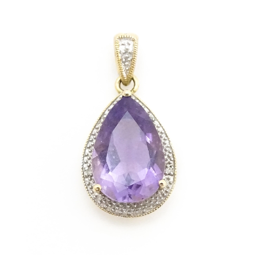 632 - A 9ct gold pendant set with amethyst and diamonds. Approx. 1