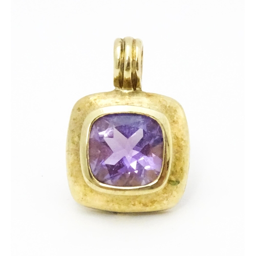 635 - A 9ct gold pendant set with central amethyst. Pendant approx. 1