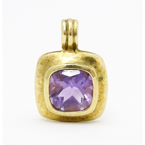 635 - A 9ct gold pendant set with central amethyst. Pendant approx. 1