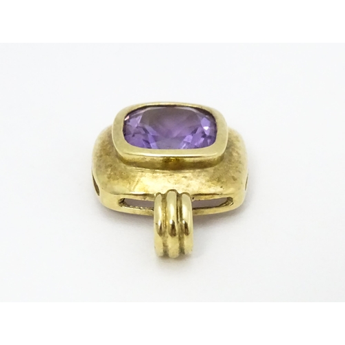 635 - A 9ct gold pendant set with central amethyst. Pendant approx. 1