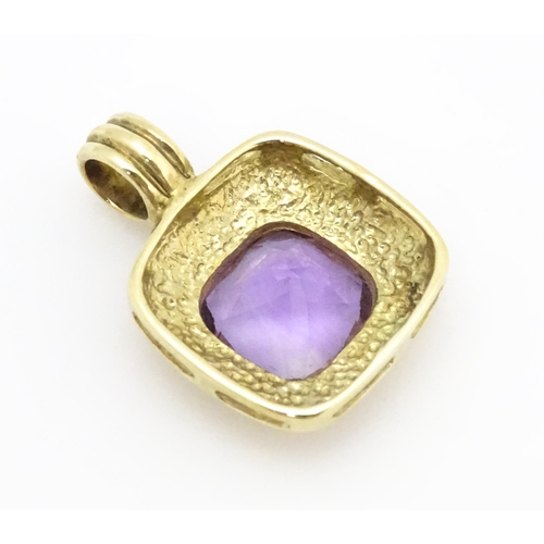 635 - A 9ct gold pendant set with central amethyst. Pendant approx. 1