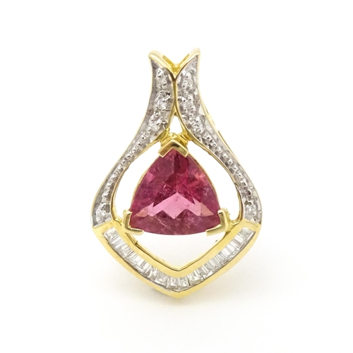 659 - An 18ct gold pendant set with central pink tourmaline bordered by diamonds. Approx. 1