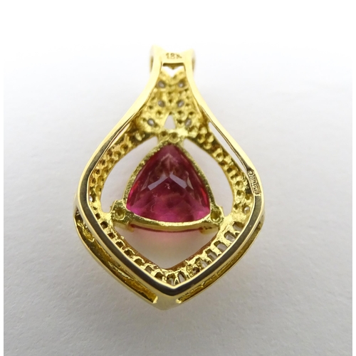 659 - An 18ct gold pendant set with central pink tourmaline bordered by diamonds. Approx. 1