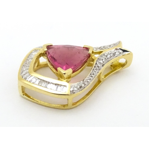 659 - An 18ct gold pendant set with central pink tourmaline bordered by diamonds. Approx. 1