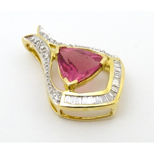 659 - An 18ct gold pendant set with central pink tourmaline bordered by diamonds. Approx. 1