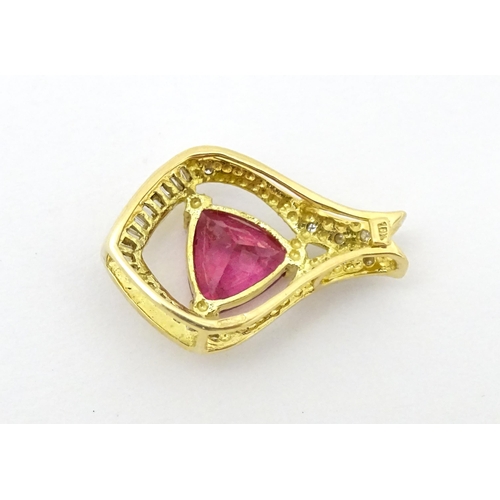 659 - An 18ct gold pendant set with central pink tourmaline bordered by diamonds. Approx. 1