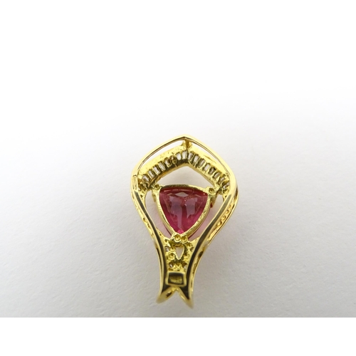 659 - An 18ct gold pendant set with central pink tourmaline bordered by diamonds. Approx. 1