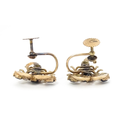 667 - A pair of vintage yellow metal earrings formed as lobsters set with blue and white stones. Approx. 1... 