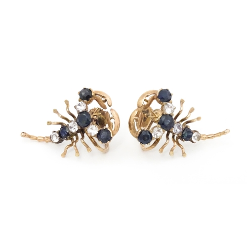 667 - A pair of vintage yellow metal earrings formed as lobsters set with blue and white stones. Approx. 1... 