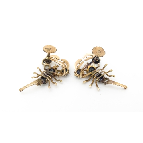 667 - A pair of vintage yellow metal earrings formed as lobsters set with blue and white stones. Approx. 1... 