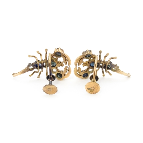 667 - A pair of vintage yellow metal earrings formed as lobsters set with blue and white stones. Approx. 1... 