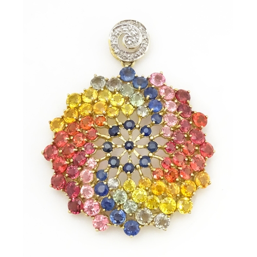 688 - A 9ct gold pendant set with diamonds and various coloured stones. Approx. 1 1/2