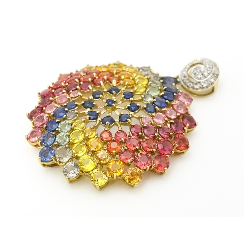 688 - A 9ct gold pendant set with diamonds and various coloured stones. Approx. 1 1/2