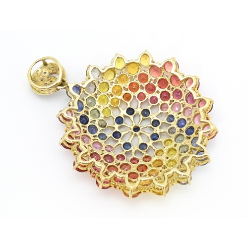 688 - A 9ct gold pendant set with diamonds and various coloured stones. Approx. 1 1/2