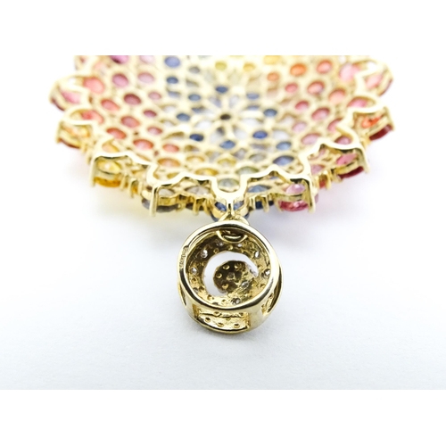 688 - A 9ct gold pendant set with diamonds and various coloured stones. Approx. 1 1/2