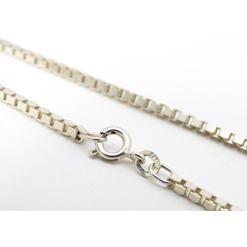 711 - A silver and white metal box link chain necklace, Approx 20