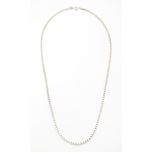 711 - A silver and white metal box link chain necklace, Approx 20