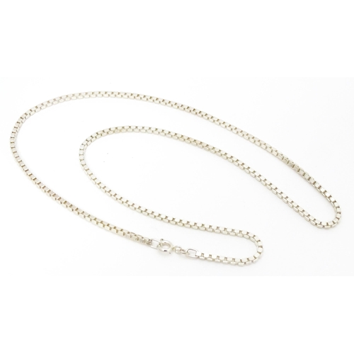 711 - A silver and white metal box link chain necklace, Approx 20