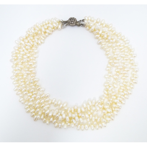 714 - A four strand pearl necklace / choker. Approx 15