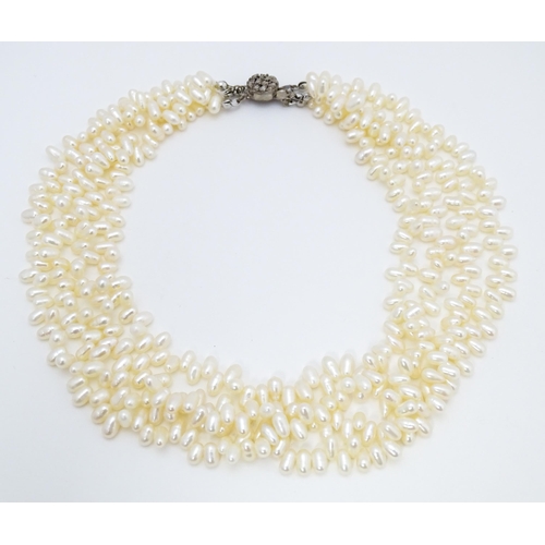 714 - A four strand pearl necklace / choker. Approx 15