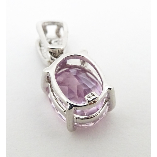 715 - A 9ct white gold pendant set with amethyst and diamonds. Approx. 3/4