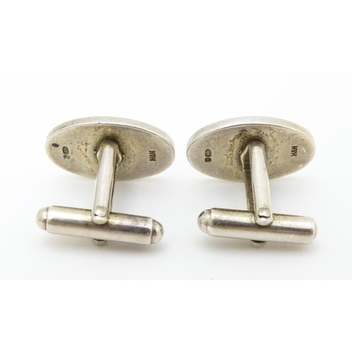 748 - Two pairs of silver cufflinks, one pair with white enamel detail (2+2)