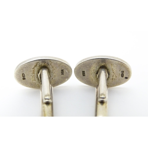 748 - Two pairs of silver cufflinks, one pair with white enamel detail (2+2)