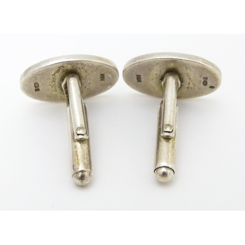 748 - Two pairs of silver cufflinks, one pair with white enamel detail (2+2)