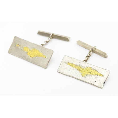 750 - A pair of Elizabeth II silver cufflinks with gilt detail hallmarked London 1984, maker AV. Approx. 1... 