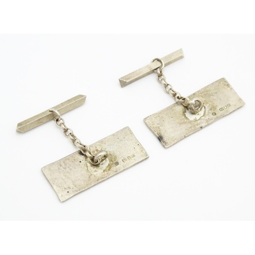 750 - A pair of Elizabeth II silver cufflinks with gilt detail hallmarked London 1984, maker AV. Approx. 1... 