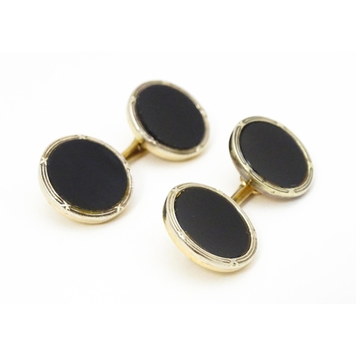 751 - A pair of 9ct gold cufflinks with black enamel detail hallmarked Birmingham 1990, maker Deakin & Fra... 