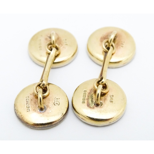 751 - A pair of 9ct gold cufflinks with black enamel detail hallmarked Birmingham 1990, maker Deakin & Fra... 