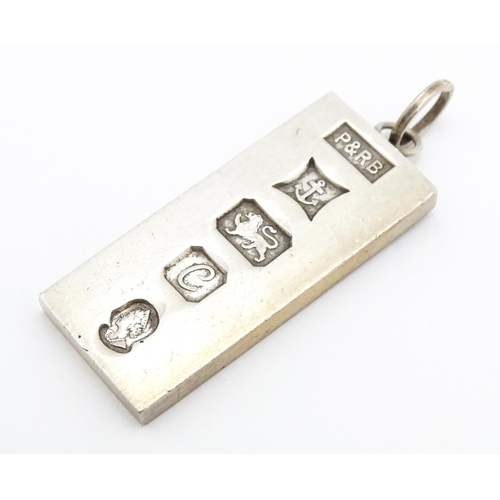 757 - A silver pendant of ingot form hallmarked Birmingham 1977 with silver Jubilee mark, maker P & R Bush... 