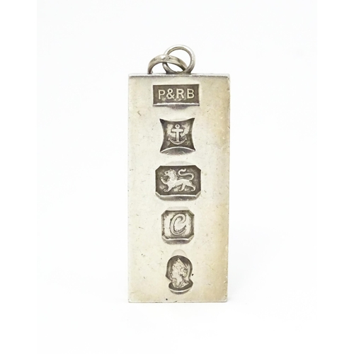 757 - A silver pendant of ingot form hallmarked Birmingham 1977 with silver Jubilee mark, maker P & R Bush... 