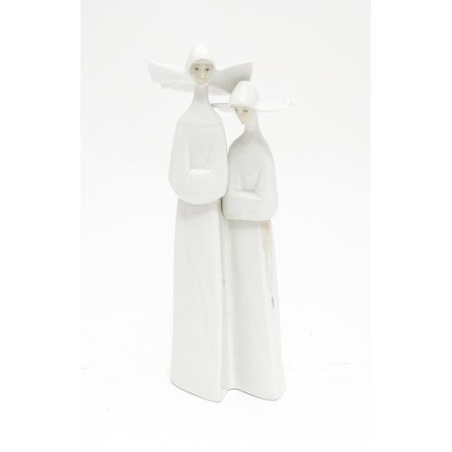 101 - A Lladro figural group depicting two nuns, model no. 4611. Approx. 13